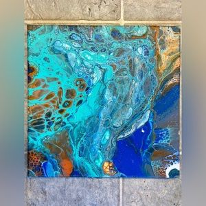 This is a 10x10 acrylic pour painting on stretched canvas.